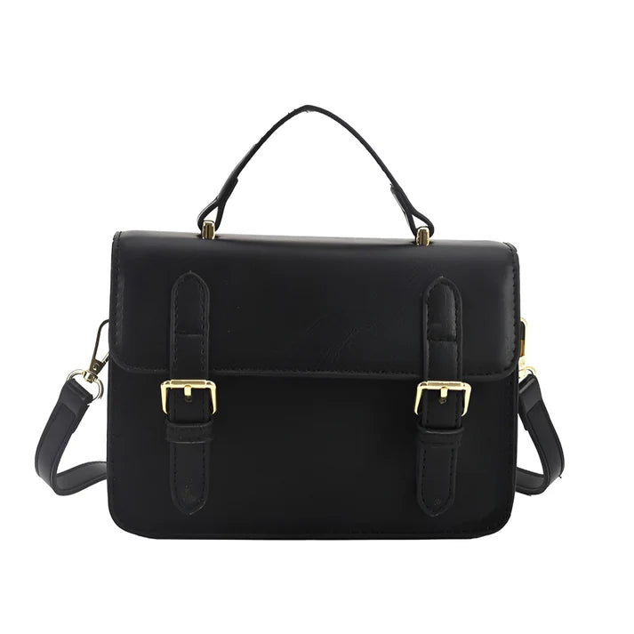 Model holding Ishna Bag – minimalist PU leather clutch with flap pocket and hasp closure in compact structured silhouette by Santori The Label