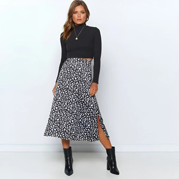 Model wearing Lydie Skirt – printed mid-calf A-line cotton skirt, styled for casual warm weather, by Santori The Label