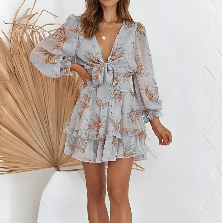 Model wearing Maricon Mini Dress – printed A-line beach dress with high stretch and natural waist by Santori The Label.