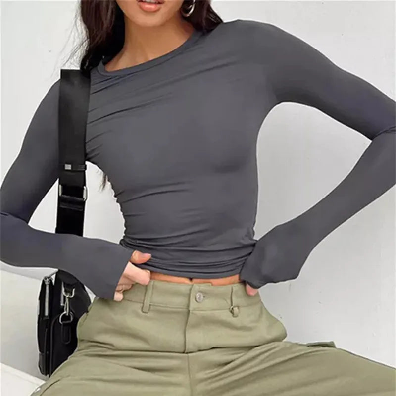 Model wearing Butter Long Sleeve Top – high stretch fitted long sleeve top in sleek, minimalist style by Santori The Label.