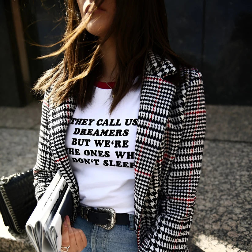 Model wearing Dreamers Top – graphic slogan crop top for women with a fitted cut and bold text print by Santori The Label.
