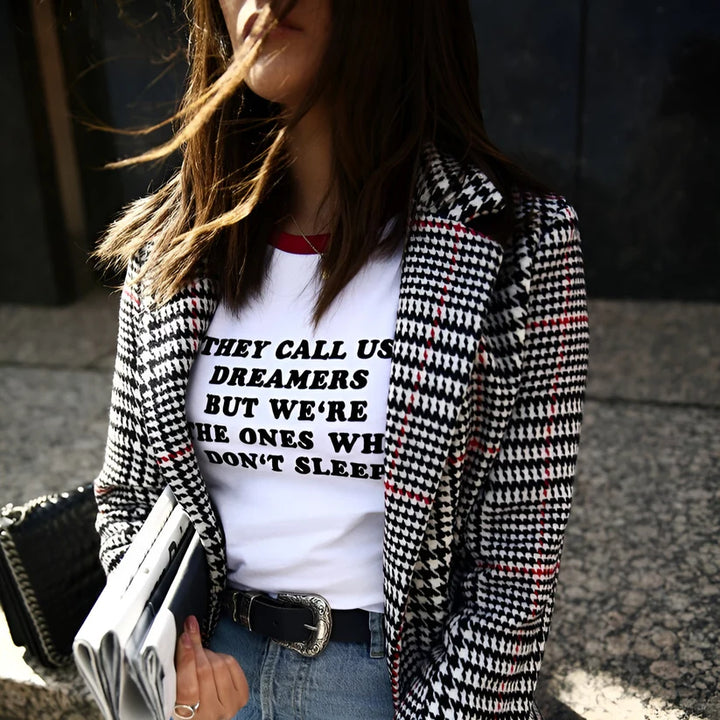 Model wearing Dreamers Top – graphic slogan crop top for women with a fitted cut and bold text print by Santori The Label.
