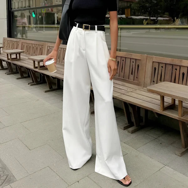 Model wearing Fierra Pants – wide leg ankle-length office trousers in smooth polyester, by Santori The Label