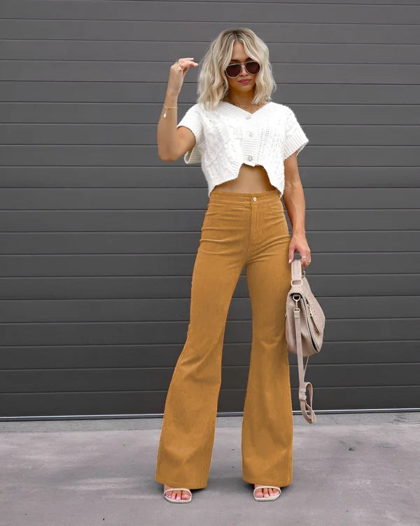 Model wearing Sheena Pants – full-length flare trousers with slim fit and mid-rise cut, styled for winter wear by Santori The Label