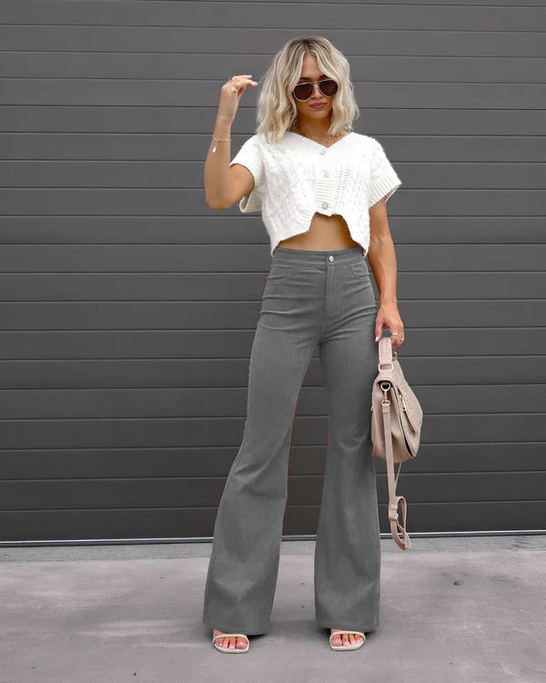 Model wearing Sheena Pants – full-length flare trousers with slim fit and mid-rise cut, styled for winter wear by Santori The Label