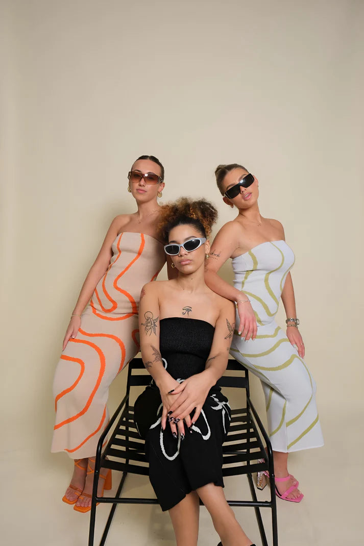 Model wearing Kerry Midi Dress – striped cotton knit bodycon midi with all-season versatility by Santori The Label.