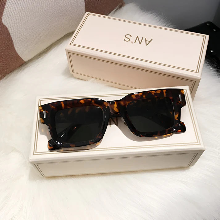 Model wearing Lexie Rectangular Sunglasses – bold cat-eye inspired UV400 fashion sunglasses with plastic frame and acrylic lenses by Santori The Label