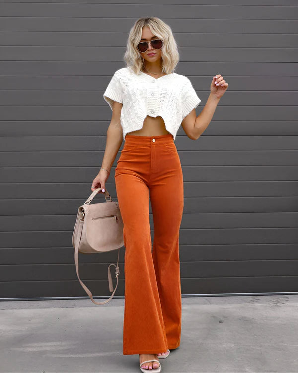 Model wearing Sheena Pants – full-length flare trousers with slim fit and mid-rise cut, styled for winter wear by Santori The Label