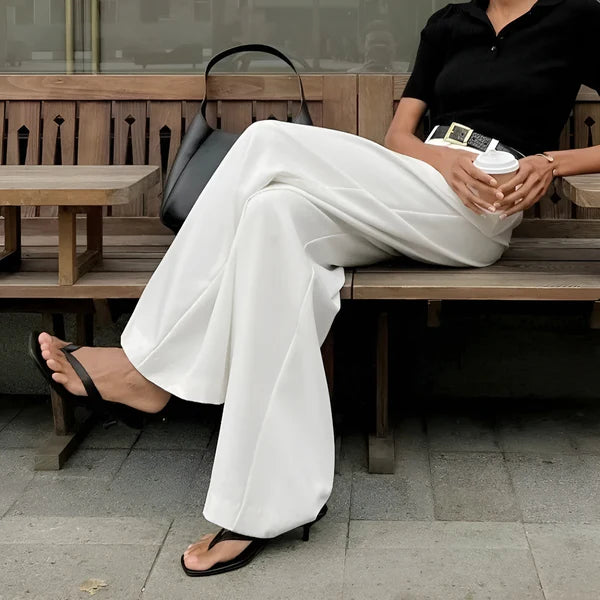 Model wearing Fierra Pants – wide leg ankle-length office trousers in smooth polyester, by Santori The Label