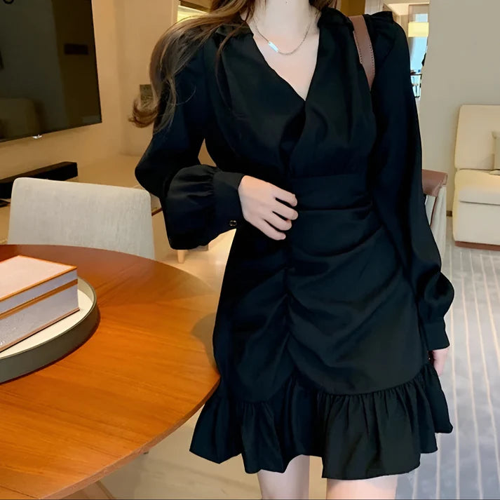 Model wearing Shaury Mini Dress – ruffled fit & flare elegant mini dress for playful occasions by Santori The Label.