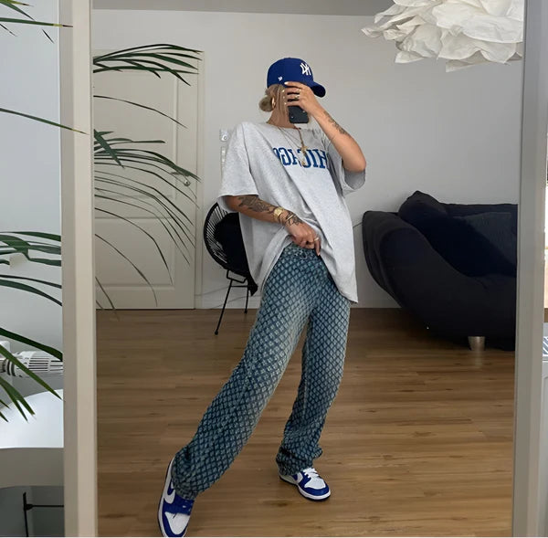 Model wearing Zilla Pants – full-length wide-leg cotton trousers with patchwork plaid detail, by Santori The Label