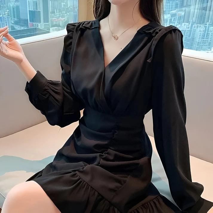 Model wearing Shaury Mini Dress – ruffled fit & flare elegant mini dress for playful occasions by Santori The Label.