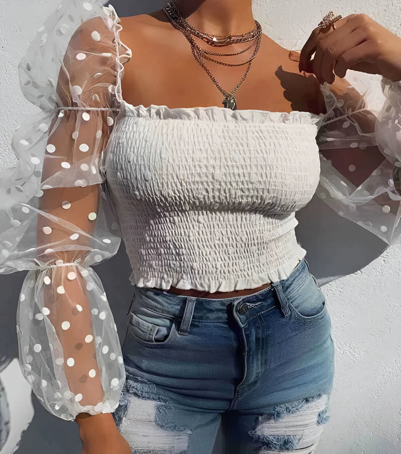 Model wearing Jezriel Top – floral embroidered crop top with hollow-out detail for summer by Santori The Label.