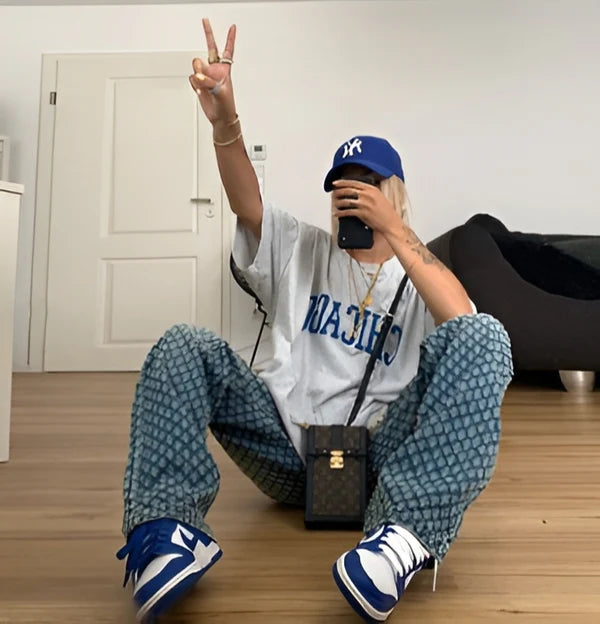 Model wearing Zilla Pants – full-length wide-leg cotton trousers with patchwork plaid detail, by Santori The Label